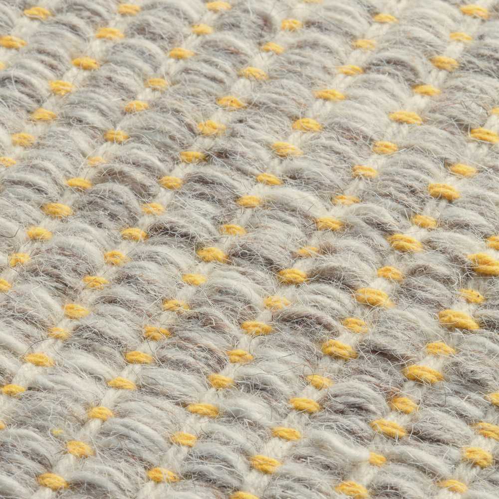 Tapis design en laine de la gamme Marvel beige et jaune