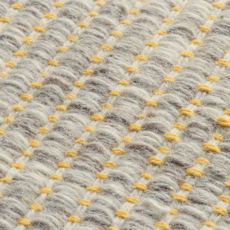 Tapis design en laine de la gamme Marvel beige et jaune
