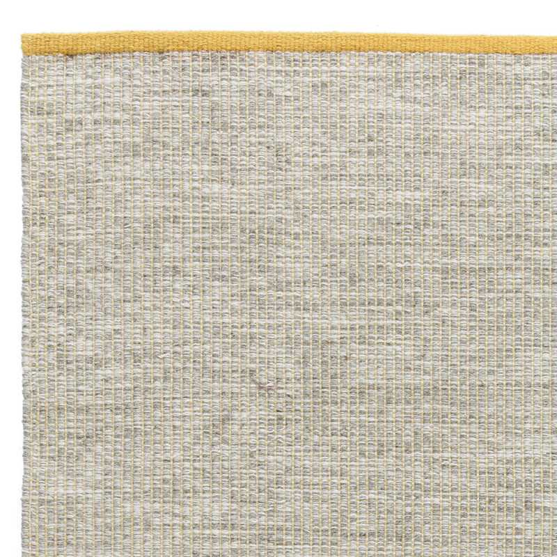 Tapis design en laine de la gamme Marvel beige et jaune