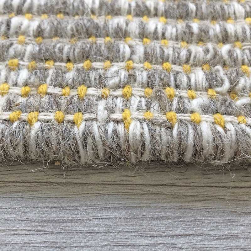 Tapis design en laine de la gamme Marvel beige et jaune