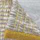 Tapis design en laine de la gamme Marvel beige et jaune