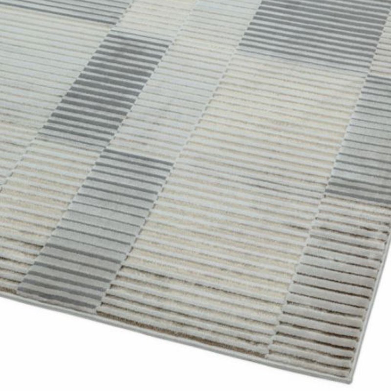 Tapis haut de gamme beige et gris aux motifs rectilignes par Joseph Lebon