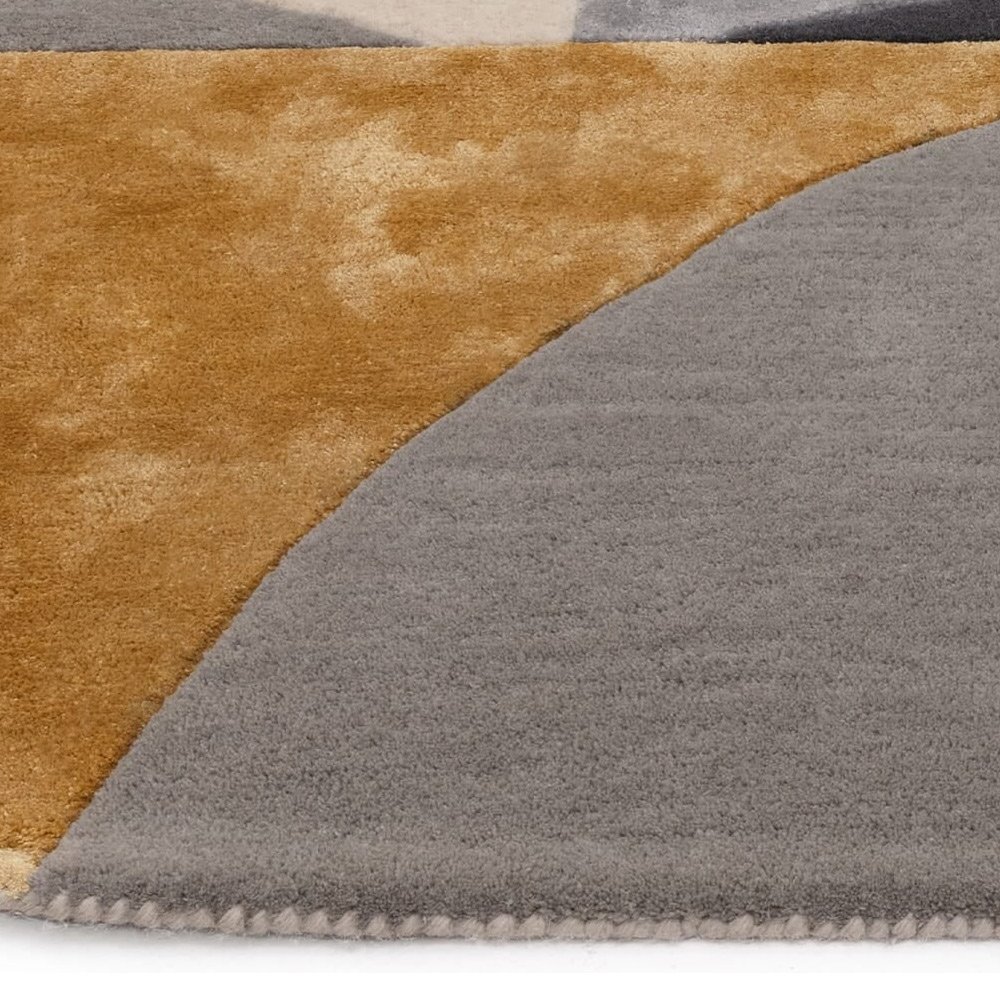 Tapis de salon ovale gris et doré  par Joseph Lebon