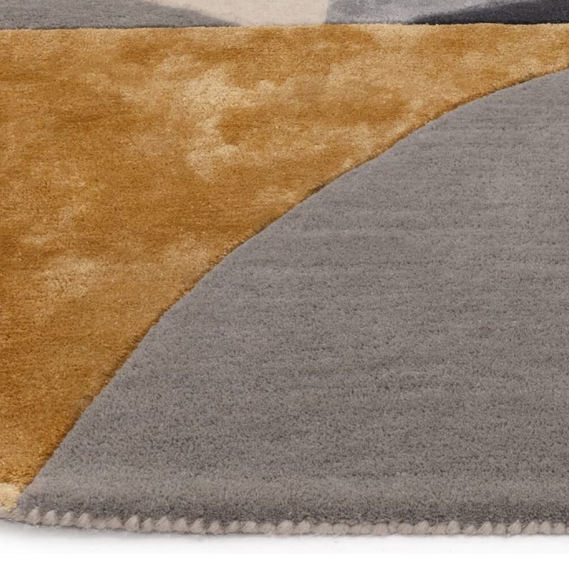 Tapis de salon ovale gris et doré  par Joseph Lebon
