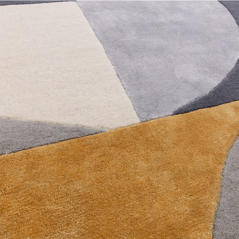 Tapis de salon ovale gris et doré  par Joseph Lebon