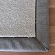 Tapis sur mesure gris clair doux et résistant finition gansée