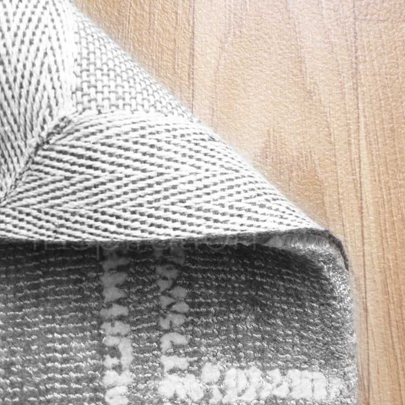Tapis de luxe gris à carreaux de la gamme Reflect en viscose par Ligne Pure